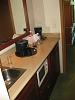 microwave and refrigerator in the embassy suites room.JPG‎