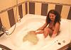 Inga relaxing in soapy bath unplugged.JPG‎